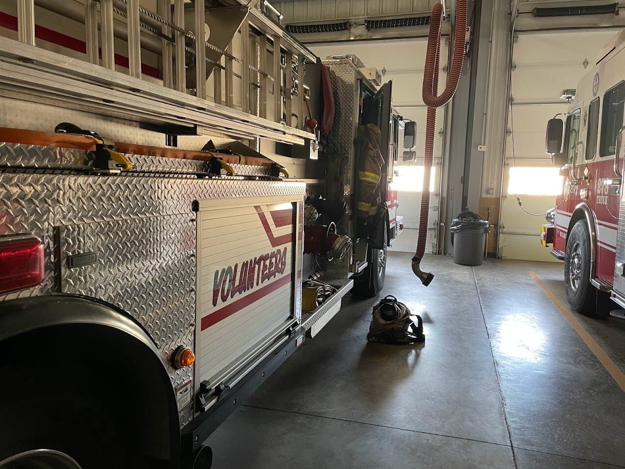 Turnout gear beside Engine 51 on the apparatus floor