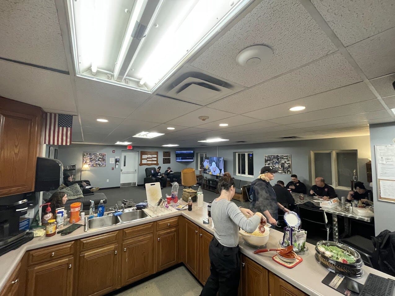 Members making dinner in the station kitchen